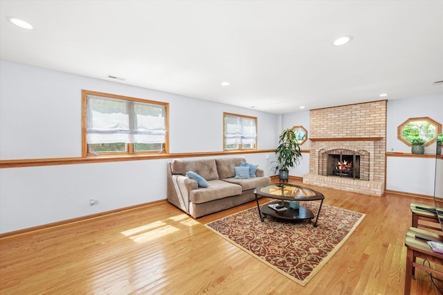 5724 W 82nd Pl, Burbank, IL 60459 - living room with healthy amount of natural light, wood finished floors, a fireplace, and recessed lighting
