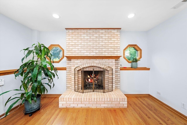 5724 W 82nd Pl, Burbank, IL 60459 - living area with wood finished floors, a brick fireplace, and recessed lighting