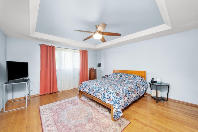 5724 W 82nd Pl, Burbank, IL 60459 - bedroom featuring a tray ceiling, wood finished floors, and ceiling fan