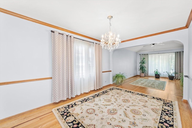 5724 W 82nd Pl, Burbank, IL 60459 - unfurnished room with arched walkways, wood finished floors, a chandelier, and a ceiling fan