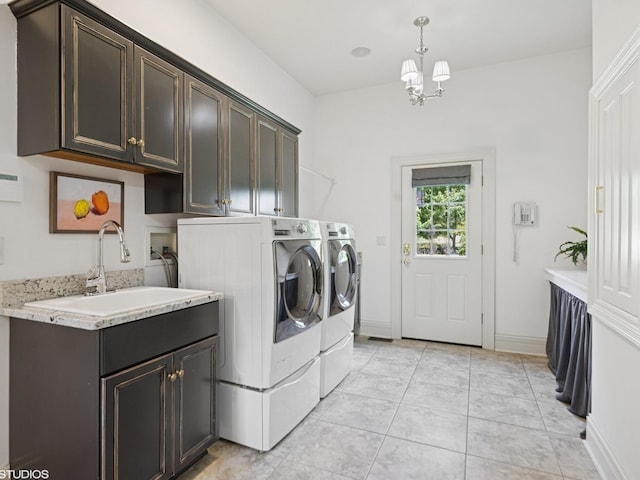5N113 Burr Rd, Saint Charles, IL 60175 - laundry area with washer and dryer, cabinet space, a chandelier, and light tile patterned flooring