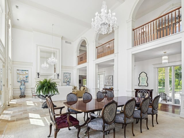 5N113 Burr Rd, Saint Charles, IL 60175 - dining room featuring a chandelier, a high ceiling, ornamental molding, and a decorative wall