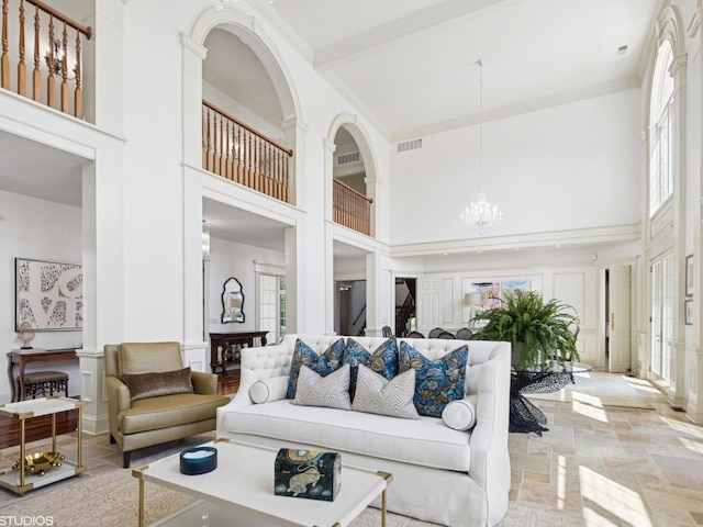 5N113 Burr Rd, Saint Charles, IL 60175 - living area with a towering ceiling, a chandelier, and crown molding