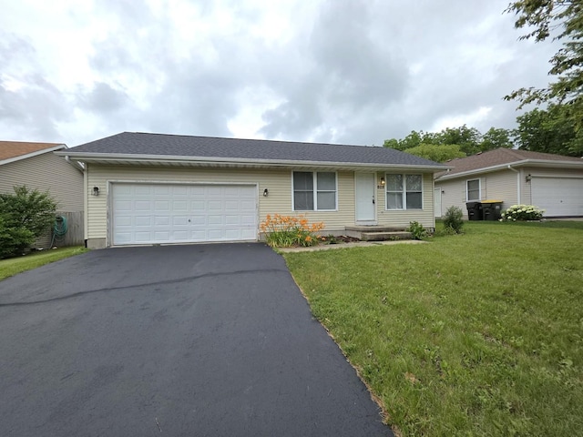 605 Tyler St, Genoa, IL 60135 - ranch-style home with asphalt driveway, an attached garage, and a front yard