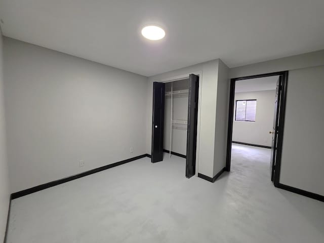 605 Tyler St, Genoa, IL 60135 - unfurnished bedroom with baseboards and a closet