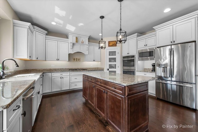 1075 Redbud Ln, Sugar Grove, IL 60554 - kitchen featuring appliances with stainless steel finishes, dark wood-style floors, white cabinetry, recessed lighting, and hanging light fixtures