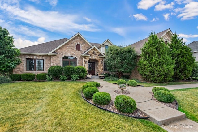 1075 Redbud Ln, Sugar Grove, IL 60554 - view of front of home with a front yard, brick siding, and roof with shingles