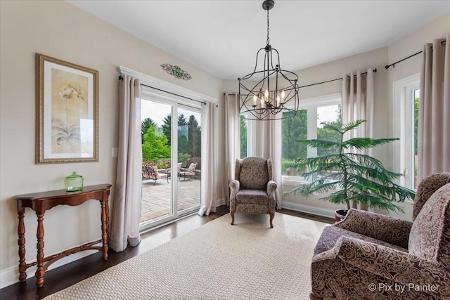 1075 Redbud Ln, Sugar Grove, IL 60554 - living area featuring healthy amount of natural light, a chandelier, and wood finished floors