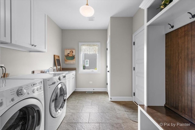 1075 Redbud Ln, Sugar Grove, IL 60554 - washroom featuring cabinet space, stone tile flooring, and washer and dryer