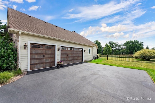 1075 Redbud Ln, Sugar Grove, IL 60554 - view of side of home featuring a garage and asphalt driveway