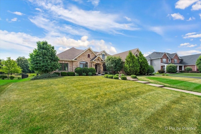 1075 Redbud Ln, Sugar Grove, IL 60554 - view of front facade with a front yard and brick siding