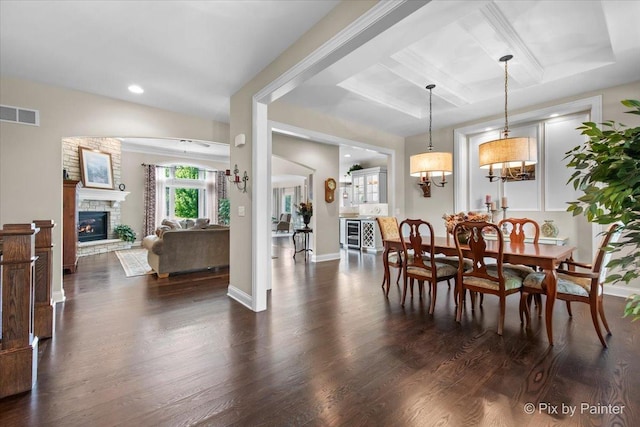 1075 Redbud Ln, Sugar Grove, IL 60554 - dining room featuring coffered ceiling, dark wood-style floors, a fireplace, recessed lighting, and beam ceiling