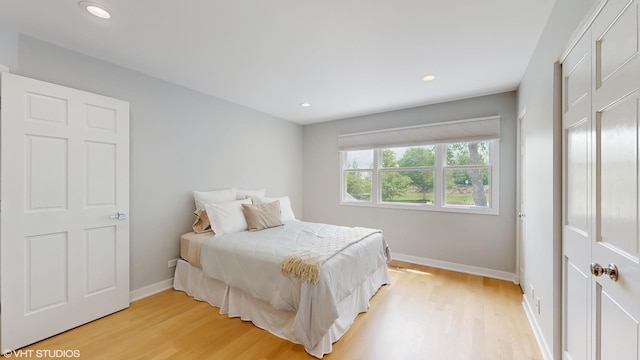 14352 Crystal Tree Dr, Orland Park, IL 60462 - bedroom with light wood-style floors and recessed lighting