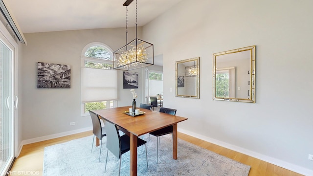 14352 Crystal Tree Dr, Orland Park, IL 60462 - dining room featuring a chandelier, wood finished floors, and vaulted ceiling