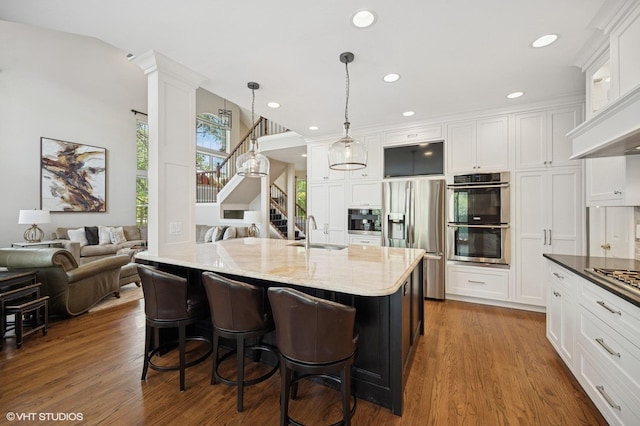 1613 Constitution Dr, Glenview, IL 60026 - kitchen with appliances with stainless steel finishes, white cabinets, dark wood-style flooring, and recessed lighting