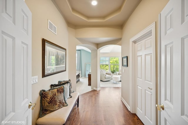 1613 Constitution Dr, Glenview, IL 60026 - hallway with arched walkways, dark wood finished floors, and a raised ceiling