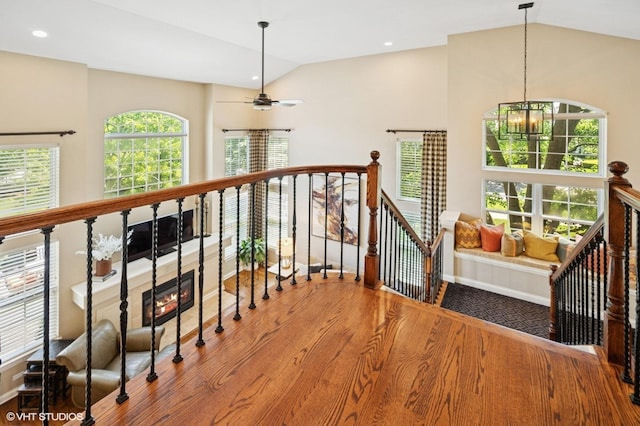 1613 Constitution Dr, Glenview, IL 60026 - staircase with vaulted ceiling, a chandelier, wood finished floors, plenty of natural light, and ceiling fan