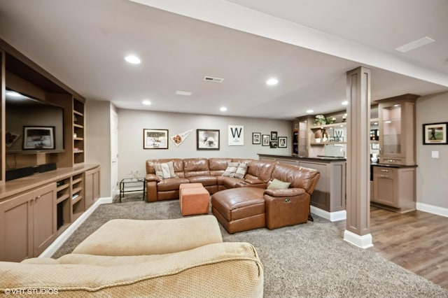 1613 Constitution Dr, Glenview, IL 60026 - carpeted living room with bar area, recessed lighting, and wood finished floors
