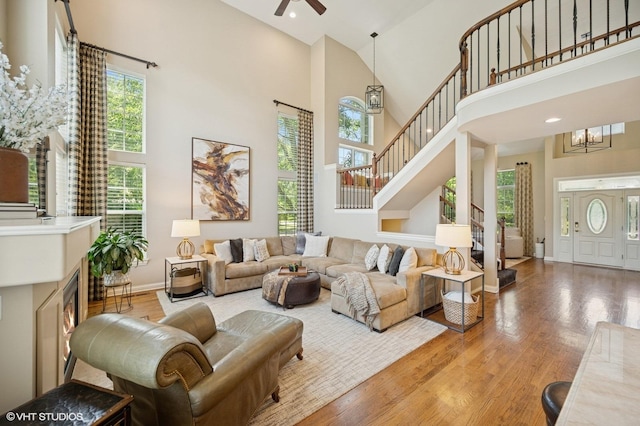1613 Constitution Dr, Glenview, IL 60026 - living area with a towering ceiling, light wood finished floors, stairs, a ceiling fan, and recessed lighting