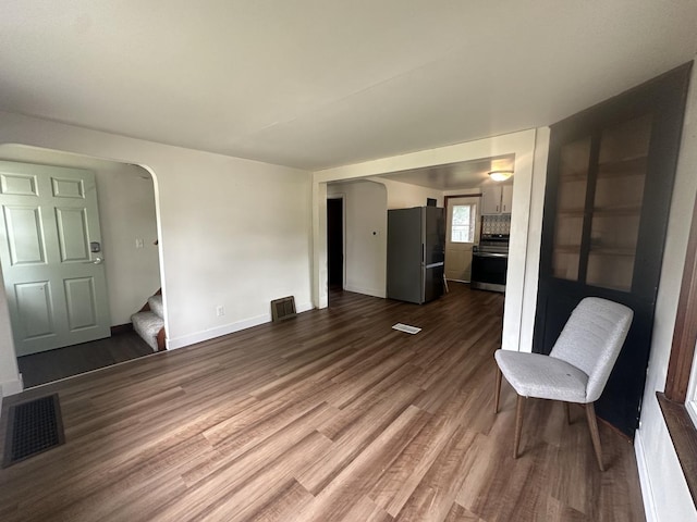1506 17th Ave, Sterling, IL 61081 - unfurnished living room with stairs and dark wood-style flooring