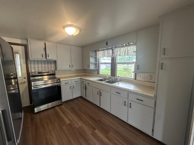 1506 17th Ave, Sterling, IL 61081 - kitchen with stainless steel range with electric cooktop, dark wood-style floors, light countertops, backsplash, and white cabinets