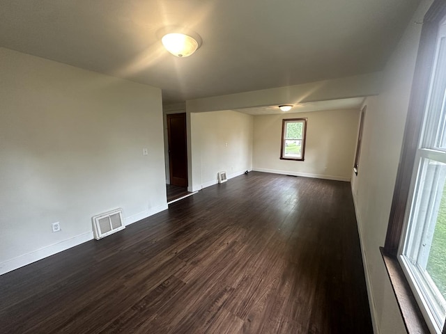 1506 17th Ave, Sterling, IL 61081 - unfurnished room with dark wood finished floors and baseboards