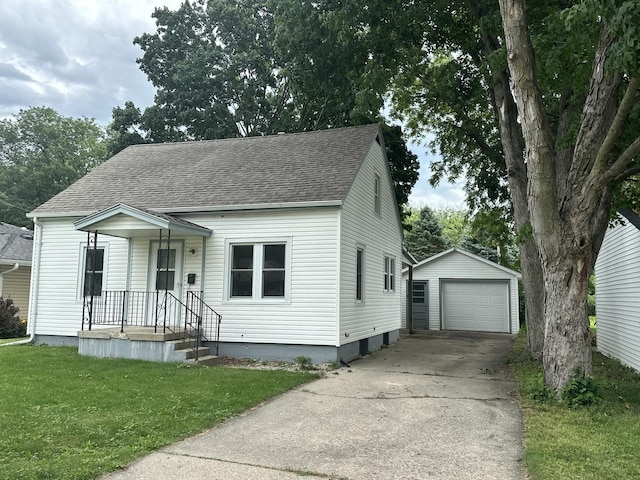1506 17th Ave, Sterling, IL 61081 - cape cod home featuring roof with shingles, a garage, an outbuilding, driveway, and a front yard