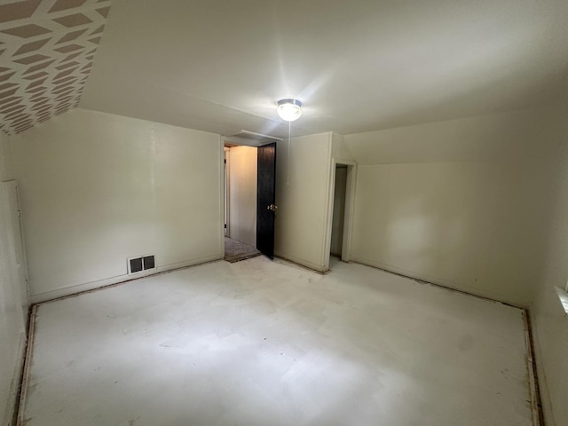 1506 17th Ave, Sterling, IL 61081 - spare room featuring concrete floors and lofted ceiling