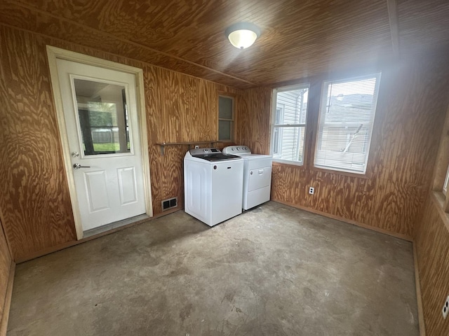 1506 17th Ave, Sterling, IL 61081 - laundry area with washing machine and clothes dryer, wood ceiling, and wooden walls