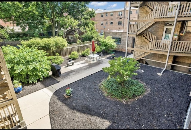 1040 Washington Blvd Unit 2, Oak Park, IL 60302 - view of property's community with a fenced backyard, a patio area, and stairs