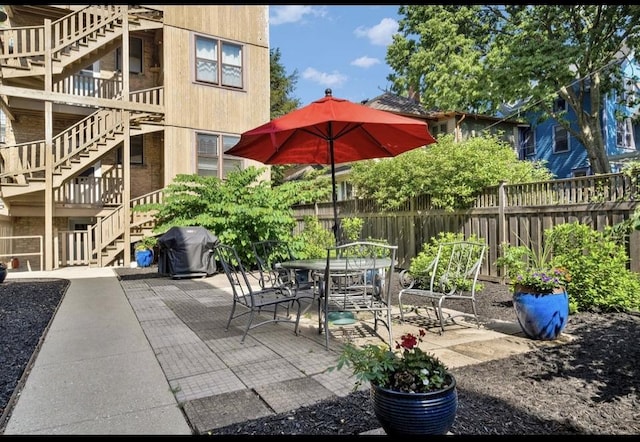 1040 Washington Blvd Unit 2, Oak Park, IL 60302 - view of patio / terrace featuring stairs, grilling area, and outdoor dining space
