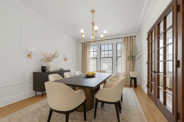1040 Washington Blvd Unit 2, Oak Park, IL 60302 - dining area with ornamental molding, a chandelier, and light wood-style flooring