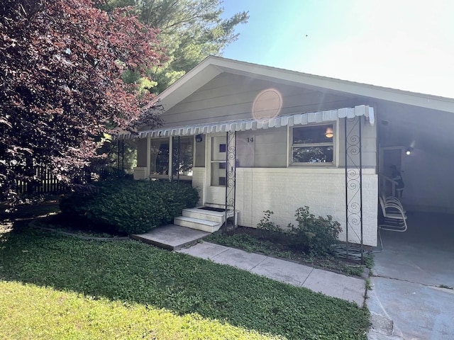 14 N Walnut St, Pesotum, IL 61863 - view of front of house featuring entry steps and a front yard