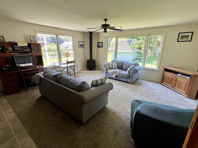 14 N Walnut St, Pesotum, IL 61863 - living room featuring a wood stove, healthy amount of natural light, and ceiling fan
