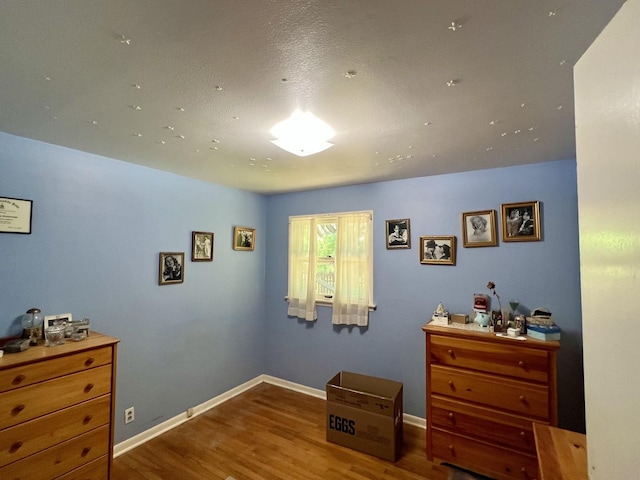 14 N Walnut St, Pesotum, IL 61863 - bedroom featuring wood finished floors and baseboards