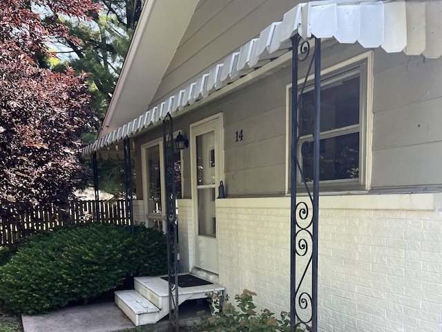 14 N Walnut St, Pesotum, IL 61863 - doorway to property with brick siding