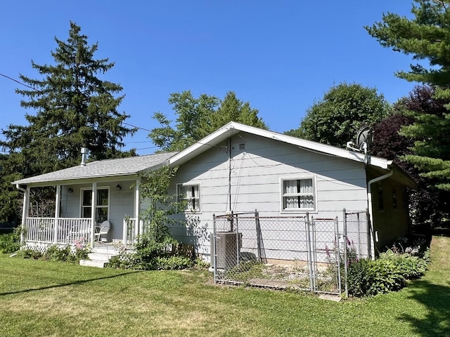 14 N Walnut St, Pesotum, IL 61863 - rear view of house with a porch
