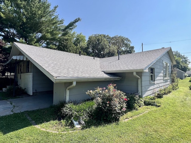 14 N Walnut St, Pesotum, IL 61863 - view of side of property with a yard and roof with shingles