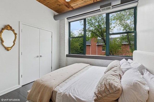 835 N Wood St Unit 301, Chicago, IL 60622 - bedroom featuring a wooden ceiling with exposed beams, dark wood-style flooring, and a closet
