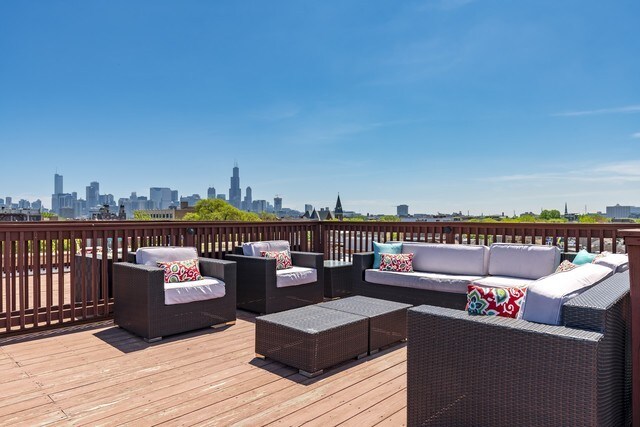 835 N Wood St Unit 301, Chicago, IL 60622 - wooden terrace featuring outdoor lounge area and a skyline view