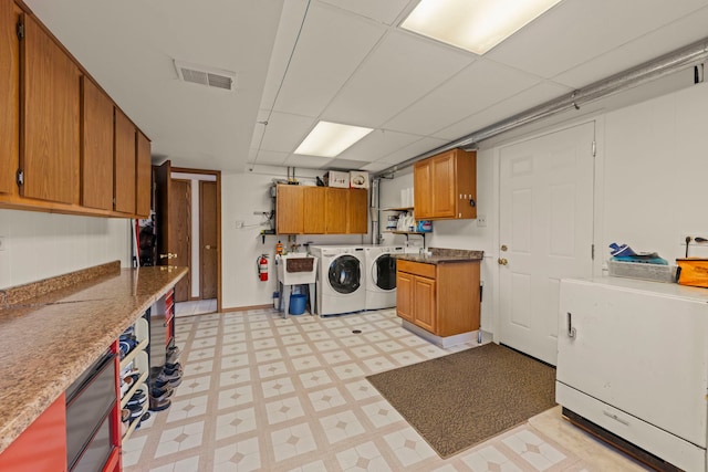 12026 Somerset Rd, Orland Park, IL 60467 - laundry room featuring washer and dryer, cabinet space, and light floors