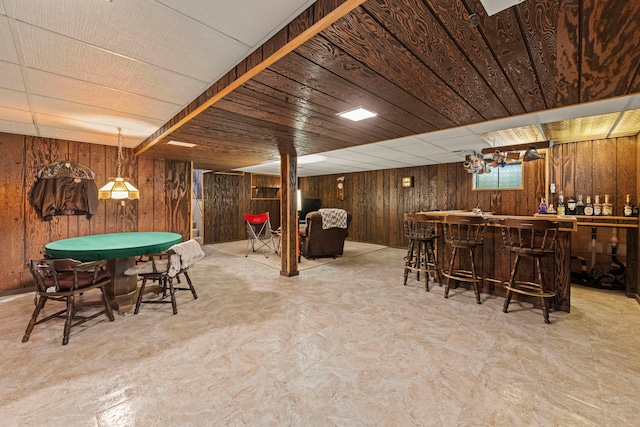 12026 Somerset Rd, Orland Park, IL 60467 - recreation room with bar, wood walls, and tile patterned floors