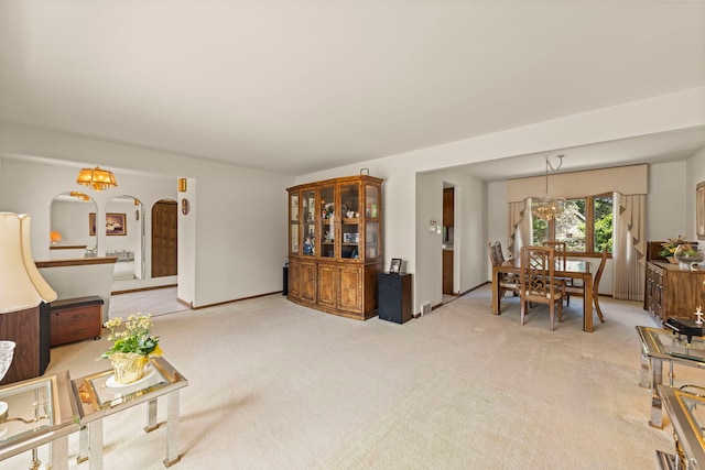 12026 Somerset Rd, Orland Park, IL 60467 - living room with a chandelier, light carpet, and arched walkways