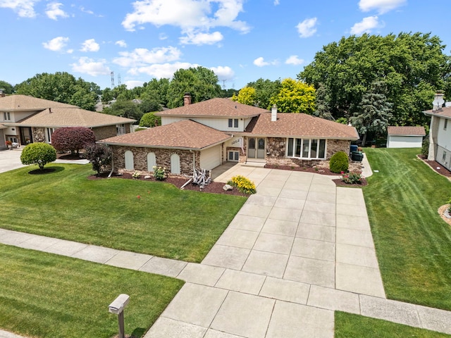 12026 Somerset Rd, Orland Park, IL 60467 - tri-level home featuring a front lawn, a garage, driveway, a chimney, and stone siding