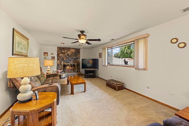 12026 Somerset Rd, Orland Park, IL 60467 - living area featuring ceiling fan, a stone fireplace, and light carpet