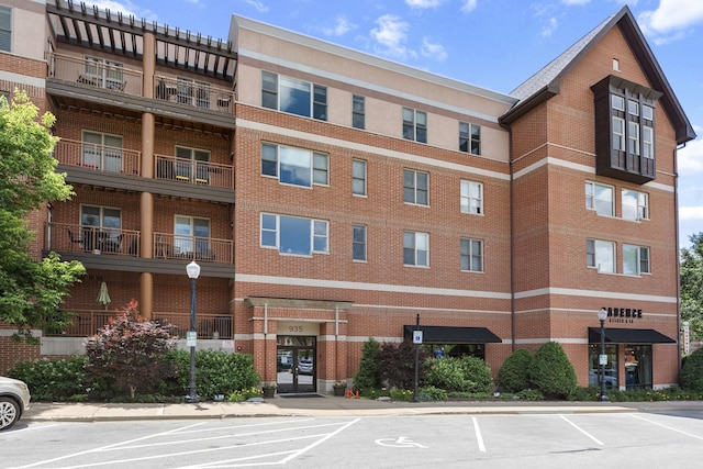 935 Burlington Ave Unit 411, Downers Grove, IL 60515 - view of property featuring uncovered parking