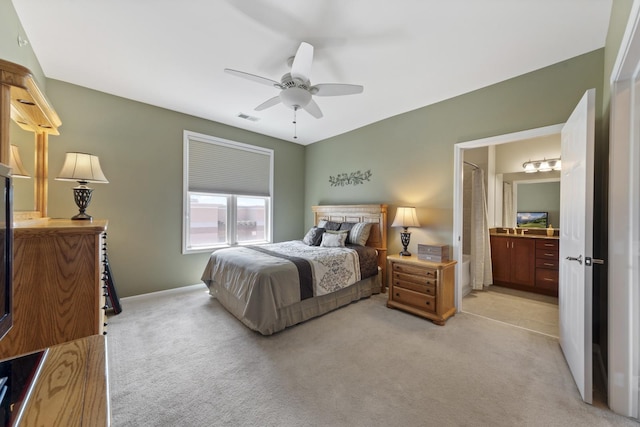 935 Burlington Ave Unit 411, Downers Grove, IL 60515 - bedroom with light carpet, ceiling fan, and connected bathroom