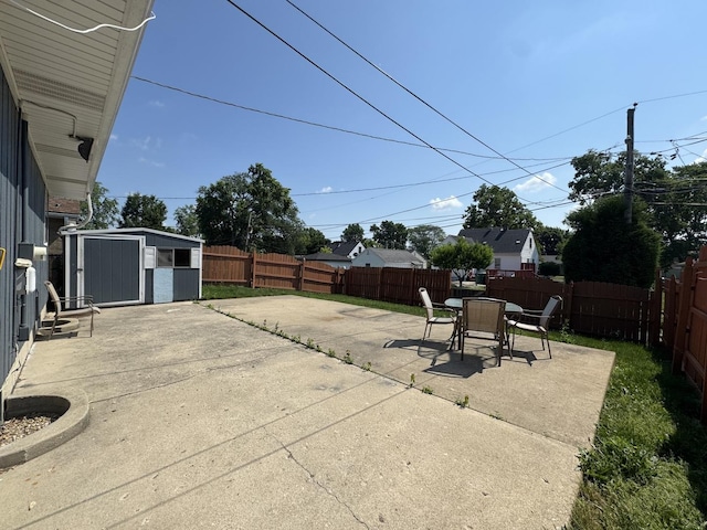 1106 Frederick St, Joliet, IL 60435 - fenced backyard with a patio, a storage shed, and outdoor dining space