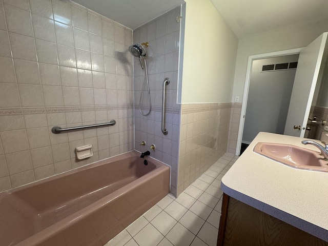 1106 Frederick St, Joliet, IL 60435 - full bath with pet washing station, tile walls, tile patterned floors, tub / shower combination, and vanity