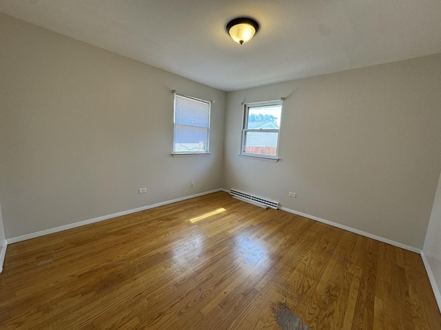 1106 Frederick St, Joliet, IL 60435 - empty room with wood finished floors and baseboards